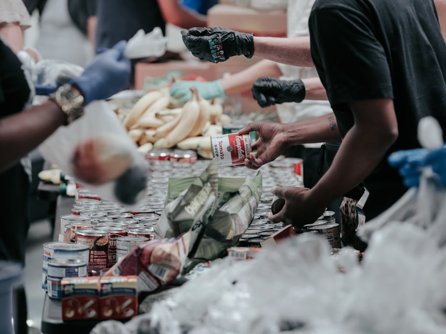 Volunteers sorting food donations together, representing PWCDC's Community Outreach program (stock photo placeholder)