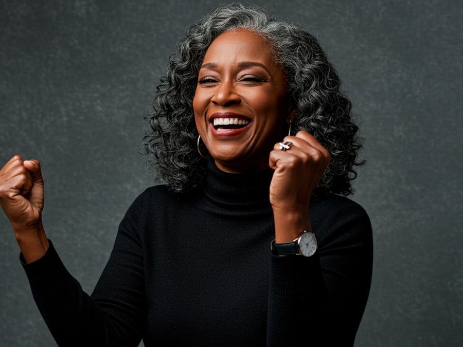 A joyful older woman celebrating, representing PWCDC's Senior Services program (stock photo placeholder)